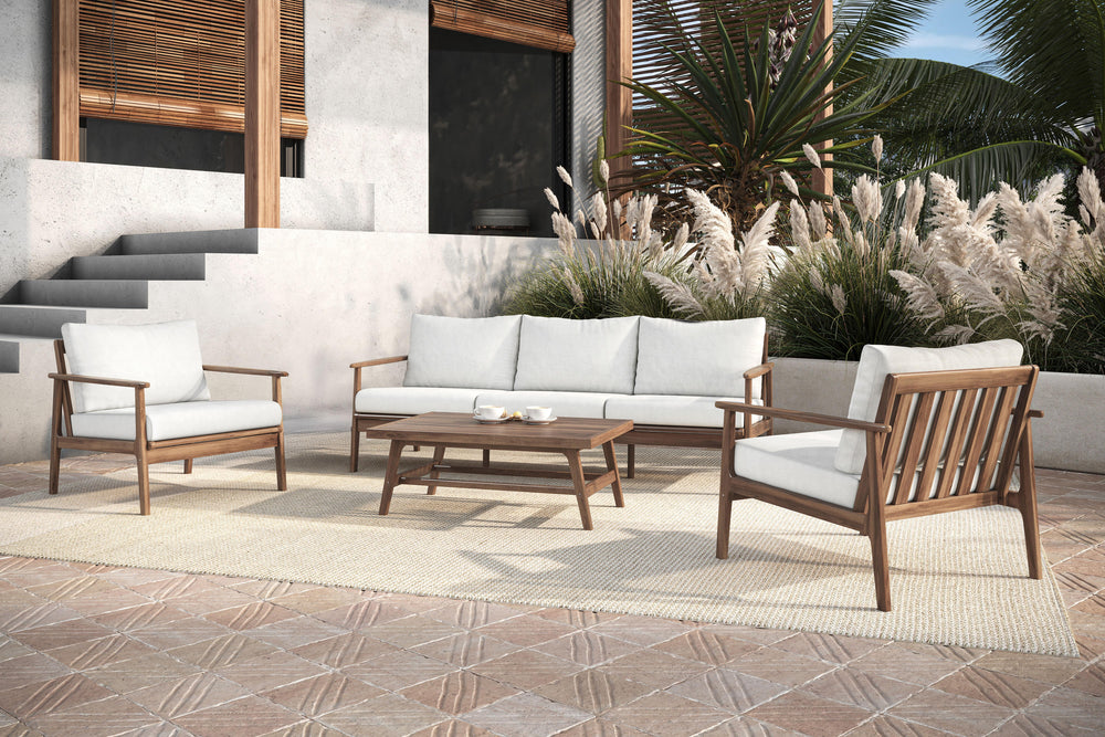 The Ashton 4-Piece Patio Set in natural, featuring a spacious sofa, two club chairs, and a matching coffee table, offers the perfect combination of durability, comfort, and timeless design for any outdoor setting. Expertly crafted from FSC-Certified Acaci