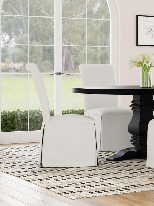  somewhat formal spin on your dining room decor with a set of two classic parson chairs. Each features a tall back with an armless profile for impeccable comfort and elegance. The chair features plush foam padding
