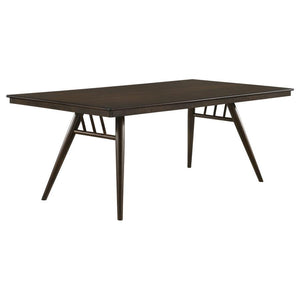Perfect for your mid-century modern dining space, this beautiful and spacious dining table brings a retro expression. A spacious rectangular table top with a bullnose edge and a fluted apron beneath offers plenty of room for six family members and guests.