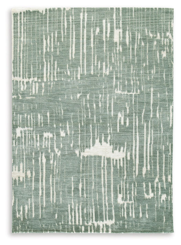 Give your floors a facelift with the abstract design of this rug. It expertly executes a marriage of color and pattern to craft a contemporary feel in your home. Stage it in a room with accent pillows or wall art in matching shades of teal for a monochrom
