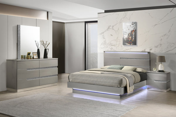 The Paradox 4 Piece Platform Bedroom Set in Gray is the epitome of modern elegance and functional design. This set includes a platform bed along with a dresser, mirror, and nightstand. The gleaming Gray gloss laminate finish offers a sleek, contemporary l