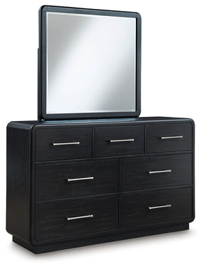 Inspired by art deco design, this softly shaped dresser with mirror makes a lasting impression in a simply stunning way. Its magnificent curved silhouette is enhanced by a rich layered black finish on the textured wood grain surface. This is the statement