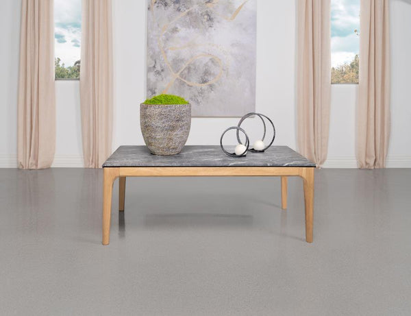  flaunting a rectangular top that offers the luxurious look of marble without the weight. Its high-pressure laminate surface
