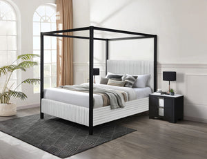 Redefine luxury and style in your bedroom with this stunning canopy bed, designed to make a bold yet elegant statement. Its sleek, minimalist frame provides a modern take on timeless sophistication, while the upholstered headboard, featuring soft vertical