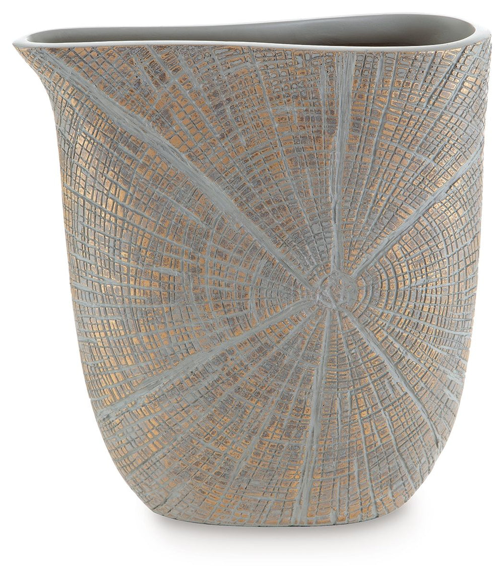 This vase is exquisitely designed with artisanal appeal and a starburst pattern. A unique mix of primitive and modern, it displays a wide mouth to hold your most bountiful bouquets. The intriguing silhouette captures the eye, complementing a room craving 