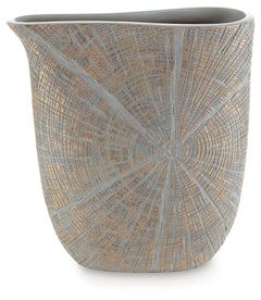 This vase is exquisitely designed with artisanal appeal and a starburst pattern. A unique mix of primitive and modern, it displays a wide mouth to hold your most bountiful bouquets. The intriguing silhouette captures the eye, complementing a room craving 