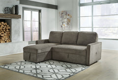 This sectional with pop up bed is an essential for small spaces and hosts with the most. The multifunctional piece is fashioned with dark gray upholstery that suits styles from transitional to modern. Its pop up bed provides extra sleeping space for guest