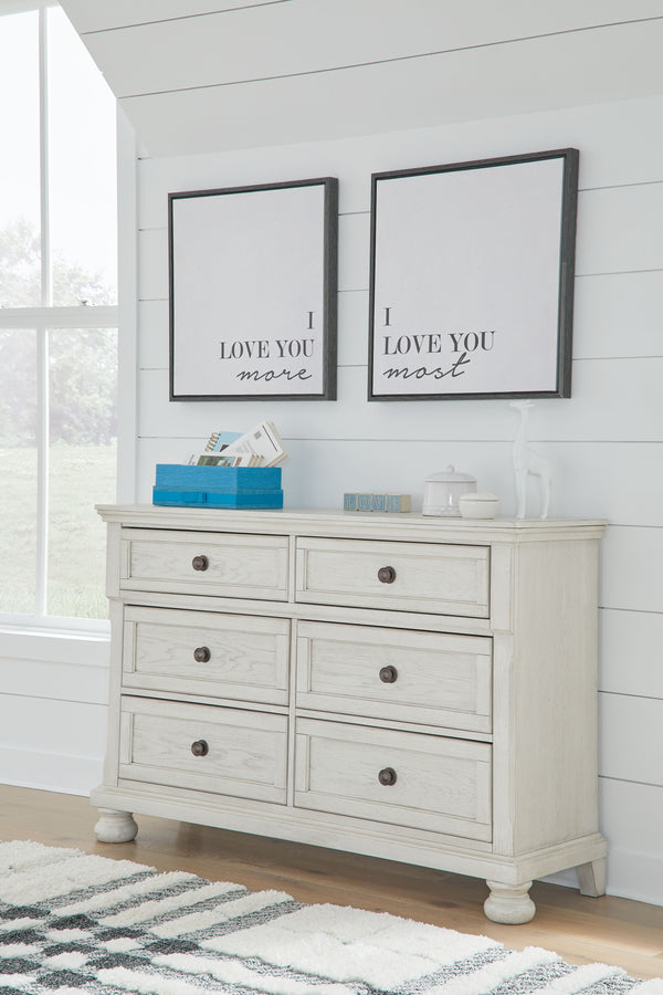 while drawers with dark bronze-tone knobs add a soph