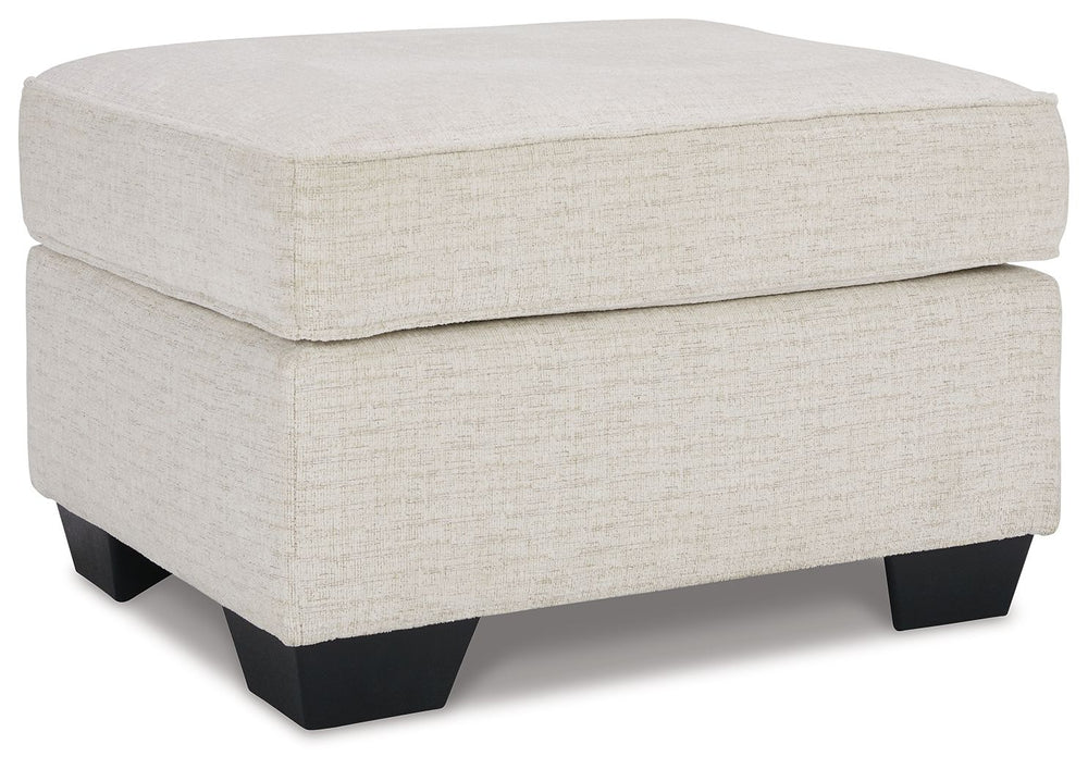 Need a simple style refresh? Liven up your living room essentials with this ottoman. A chunky silhouette holds inviting cushioning perfect for propping up feet or a decorative tray. Crosshatched upholstery gives the otherwise casual design a delightful vi