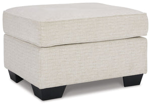 Need a simple style refresh? Liven up your living room essentials with this ottoman. A chunky silhouette holds inviting cushioning perfect for propping up feet or a decorative tray. Crosshatched upholstery gives the otherwise casual design a delightful vi