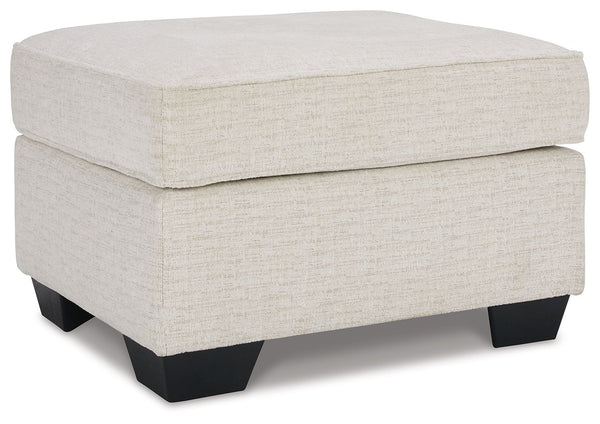 Need a simple style refresh? Liven up your living room essentials with this ottoman. A chunky silhouette holds inviting cushioning perfect for propping up feet or a decorative tray. Crosshatched upholstery gives the otherwise casual design a delightful vi