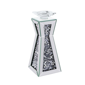 Strut your style with this beautiful and elegant Nowles candleholder collection. With a beautifully crafted mirrored frame and faux gem inlay, it is sure to compliment any arrangement. Available in two different sizes, light it up and be dazzled by the gl