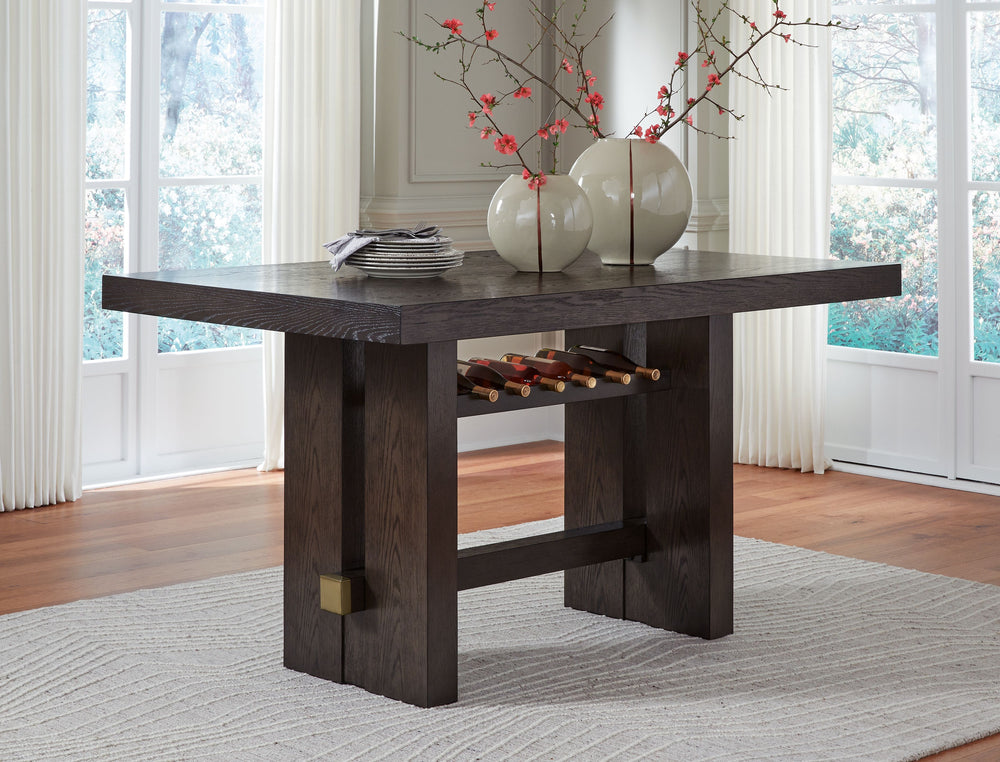 Dressed to thrill, this counter height dining table offers a high-design look at a down-to-earth price. Ultra-sleek lines are accentuated with a dark waxy brown oak-tone finish thatâ€™s so easy on the eyes. A thick tabletop and a pedestal base with integr