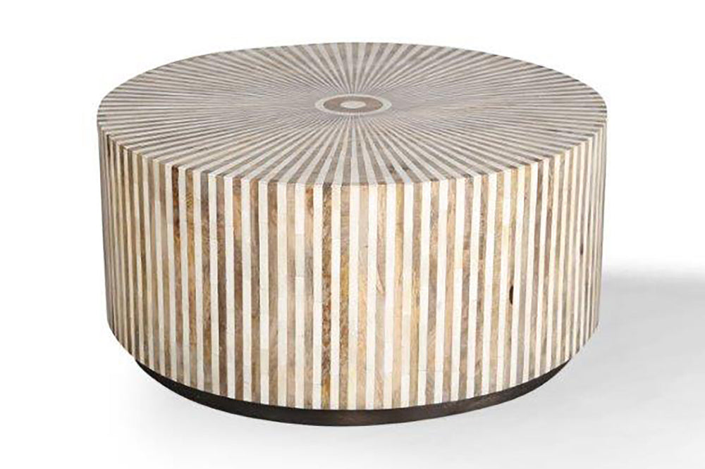 A natural fit for urban and suburban home dÃ©cor, the Downtown round cocktail table offers a casual luxury with a youthful, slightly Boho vibe. Organic yet refined this 38 inch diameter table is made from mango wood and bone inlay in a beautiful radial pa