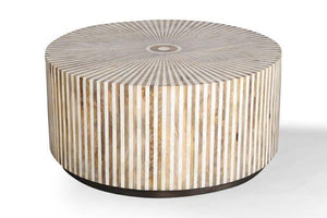  the Downtown round cocktail table offers a casual luxury with a youthful