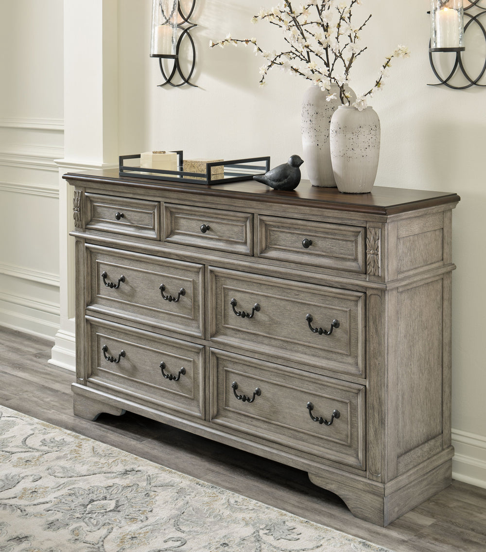 Cottage quaint styling and quality construction make this dresser a dream come true. A two-tone finish provides rustic warmth, with an antiqued gray body and a rich, deep walnut on the top. Framed drawer fronts and dark bronze-tone hardware marry classic 