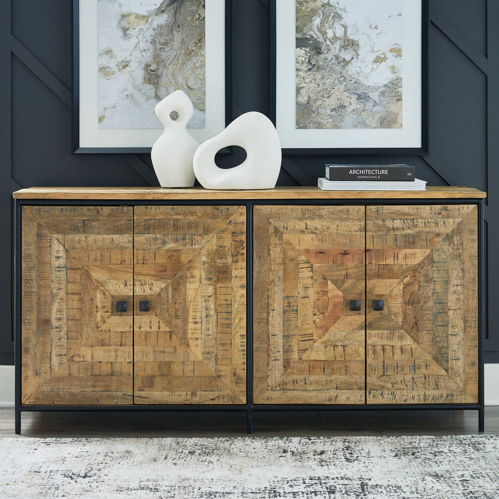 Bold in scale and rich in character, this accent cabinet makes a dramatic backdrop for entertaining. Its square patterned door fronts boast a saw mark effect, while black accents lend industrial appeal to the design. Radiating an aura of welcoming warmth,