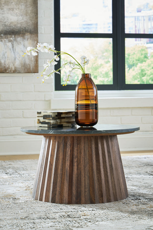  the mixed-material accent piece wows with a marble top and a fluted wood base. This organic beauty can be used on its own or grouped with other piece