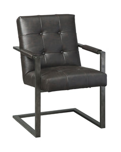 For fans of urban industrial design, this chair steals the show. Its metal C-frame in a blackened gunmetal finish is sleek, sculptural and ultra modern. Crafted for looks and comfort, the tufted box seat, wrapped in a â€œweatheredâ€ faux leather upholste