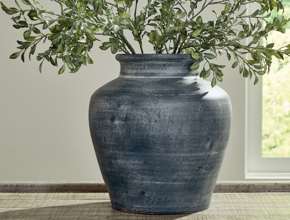 Understated in its beauty, this vase offers a traditional feel courtesy of its terra cotta construction. The antiqued look is brought into the present with a distressed blue hue. It-'s an effortless way to elevate a centerpiece, bookshelf or mantle. Add f