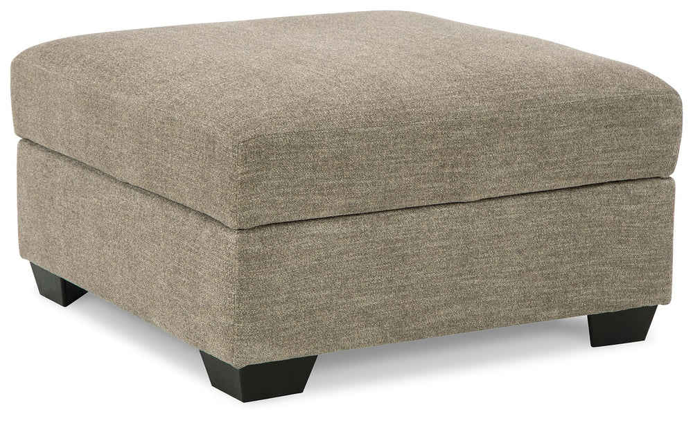 This ottoman adds a richly neutral aspect to your living space. This versatile companion piece offers ample storage space plus a tabletop with cup holders on the reverse side of the removable cushion.<br><br><b>Additional Dimensions</b><br><ul><li>Leg hei