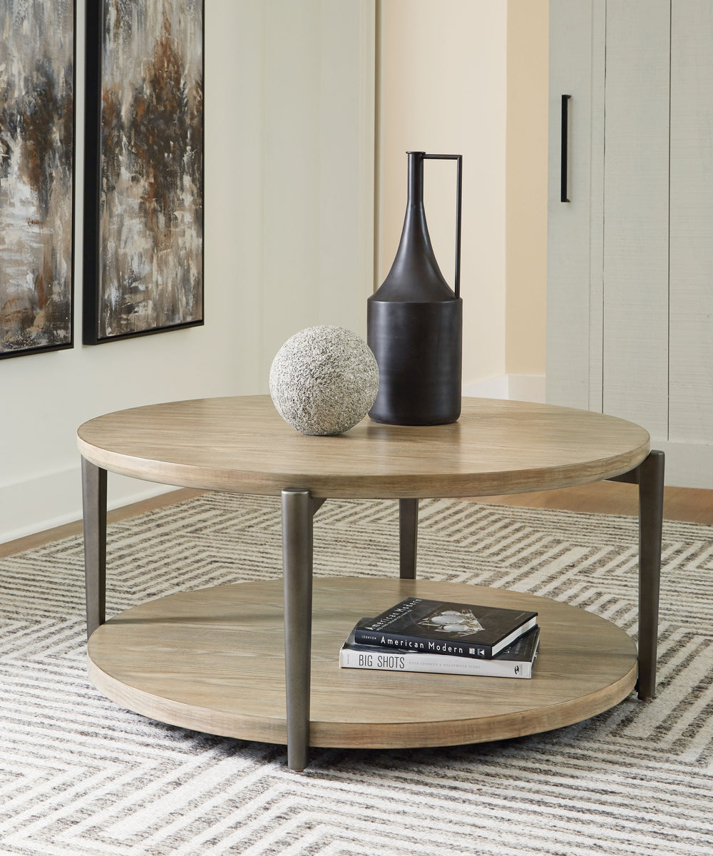 Merging industrial and contemporary elements, this coffee table turns display space into an art form. The whitish brown wood-tone finish is right on trend, while contrasting painted metallic legs offer a modern touch of stripped-back beauty. With its stre