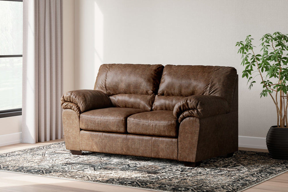 If you love the cool look of leather but long for the warm feel of fabric, youâ€™ll find this loveseat fits the bill beautifully. Rest assured, the textural, multi-tonal upholstery is rich with character and interestâ€”while plush, pillowy cushions merge 