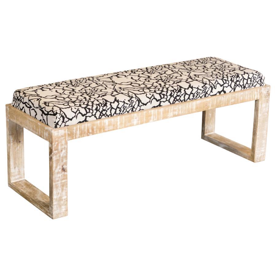 Add a bold, artistic touch to your space with this modern accent bench, featuring a striking black-and-white abstract fabric seat. The solid mango wood frame is finished in a distressed white wash, lending a rustic charm to its contemporary silhouette. Wi