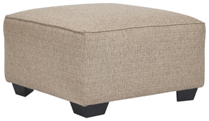 This generously scaled ottoman makes high style look effortlessly elegant. Textured linen-weave upholstery is warm, neutral and a natural complement for any space. Tri-block feet in a dark finish add a nice contrast and tailored touch.<br><br><b>Additiona