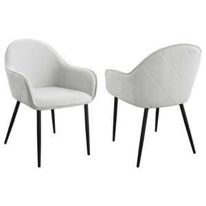 Introduce modern sophistication to your dining space with these timeless dining side chairs. Their elegant silhouette and full wrap-around seats exude timeless charm. The diamond pattern details add a touch of contemporary flair, while the rich upholstery