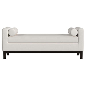  setting an austere silhouette. A pair of round bolster pillows soften the look and offer impeccable comfort an