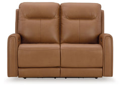 Reserved for him and made for her. This power reclining loveseat delivers all the comfort and style you could ask for. Inspired by sports car interiors, the expertly matched leather and faux leather upholstery features jumbo stitching for even more appeal