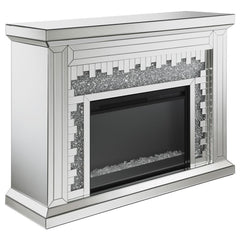 Crushed crystal accents glimmer and sparkle in this unforgettably stunning modern fireplace. Wrapped in a beveled mirror trim and tile all over to give a highly polished effect, this freestanding fireplace resembles a traditional style flanked by column-l