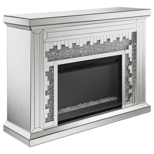 Crushed crystal accents glimmer and sparkle in this unforgettably stunning modern fireplace. Wrapped in a beveled mirror trim and tile all over to give a highly polished effect, this freestanding fireplace resembles a traditional style flanked by column-l