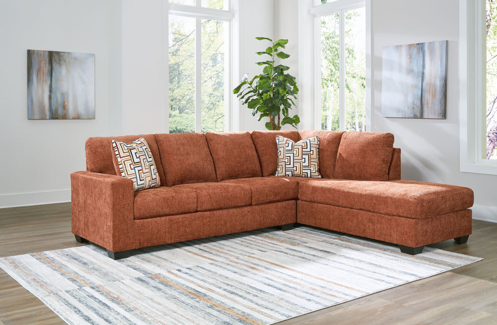 Looking to make a bold statement with color? Liven up your living room with this sectional with chaise. Its trend-right burnt orange upholstery adds a playful pop of color to your decor. Bold and eclectic accent pillows complete the look. Pairing posh sty