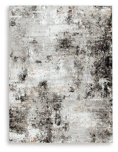 Wonderfully versatile and richly understated, this area rug brings plush comfort and a highly contemporary point of view to your decor. Incorporating so much visual texture, the abstract black, gray, white and tan design is a masterpiece of subtlety. Itâ€