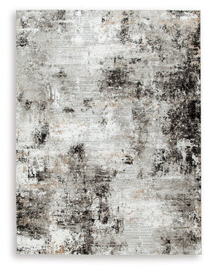 Wonderfully versatile and richly understated, this area rug brings plush comfort and a highly contemporary point of view to your decor. Incorporating so much visual texture, the abstract black, gray, white and tan design is a masterpiece of subtlety. Itâ€