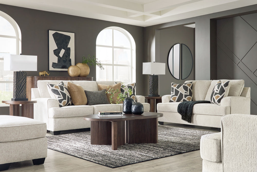 Embrace effortless elegance with this sofa and loveseat set with matching oversized chair and ottoman. Its clean lines and curved details are right at home in contemporary settings. Stressed about styling? The neutral hue easily pairs with your existing c