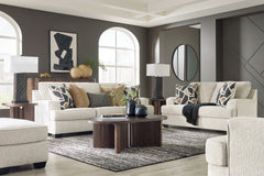 Embrace effortless elegance with this sofa and loveseat set with matching oversized chair and ottoman. Its clean lines and curved details are right at home in contemporary settings. Stressed about styling? The neutral hue easily pairs with your existing c