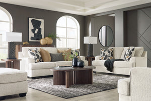 Embrace effortless elegance with this sofa and loveseat set with matching oversized chair and ottoman. Its clean lines and curved details are right at home in contemporary settings. Stressed about styling? The neutral hue easily pairs with your existing c