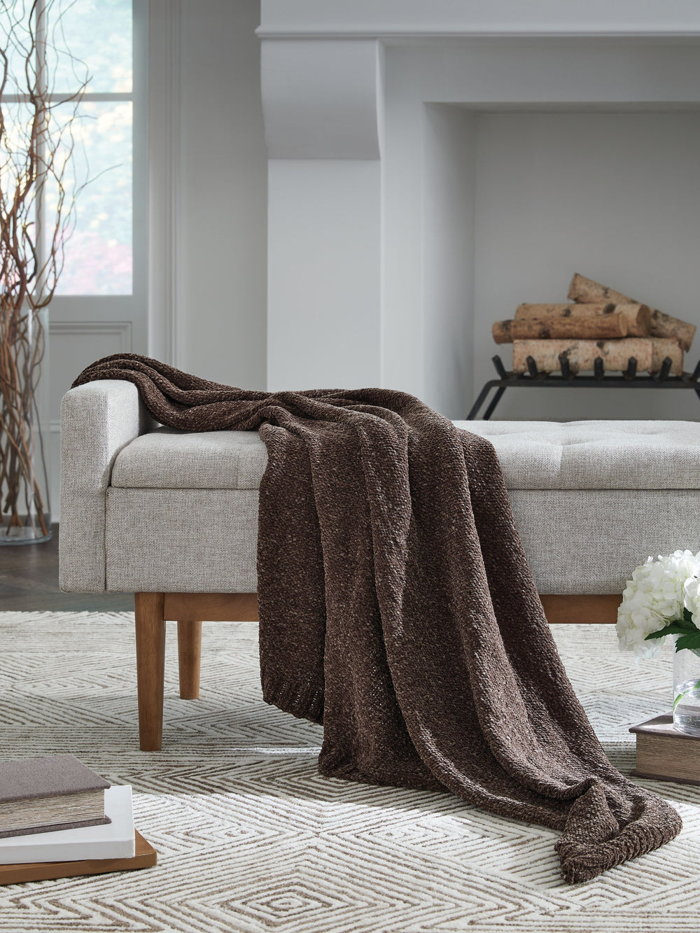 Comfort meets casually chic style in this throw blanket. Its neutral hue and knitted construction create trendy textural variation when draped over a sofa or the foot of a bed. And it goes beyond style, with the soft chenille fabric acting as a cozy compa