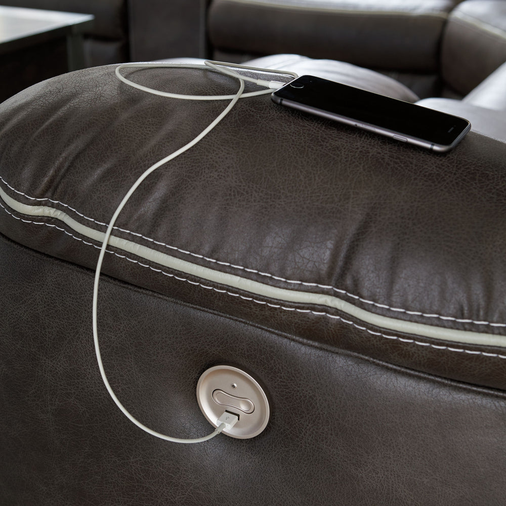 You could play it safe. Or you could choose to stand out in the crowd with this brilliantly styled sectional with power. Ultra cool, ultra contemporary and ultra comfortable, this fashion-forward sectional sports a fabulous faux leather enhanced with cont
