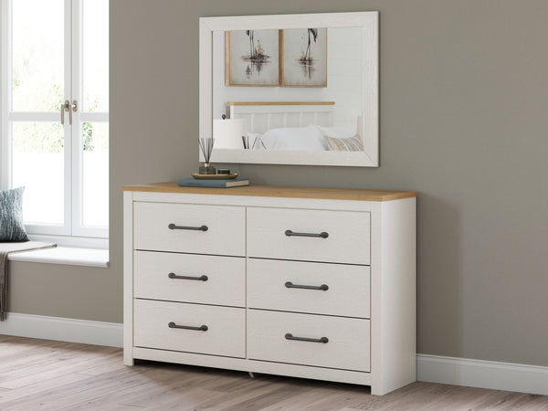  while framed drawer fronts with pewter-tone handles enhance its charming appeal. Looking for furniture that offers storage and a p