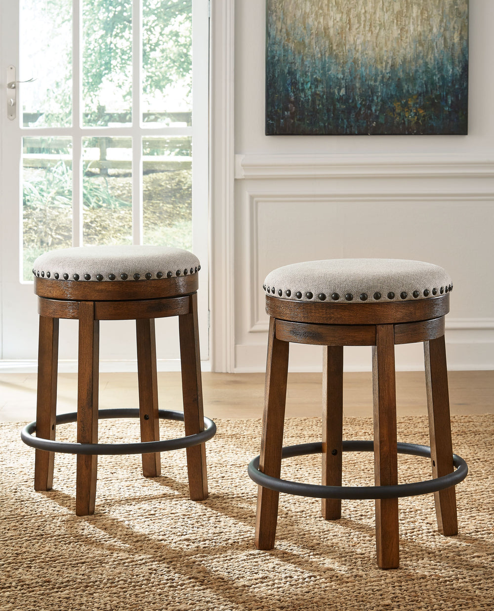 A touch of rustic-industrial style is such a fashion-forward choice, and this swivel stool doesnâ€™t disappoint. Its smooth swivel motion adds function, while nailhead trim brings effortless style. A softly upholstered cushion seat in beige keeps things c
