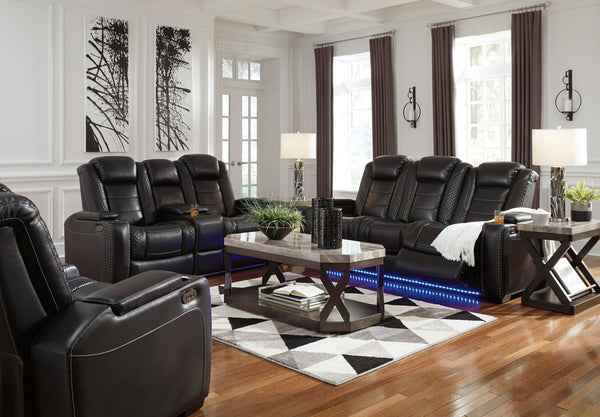 This power reclining set takes its cue from luxury automobiles with lattice- and cross-hatch stitching, for a richly tailored aesthetic that gives you plenty of reasons to celebrate. Sumptuously padded cushions and dramatic midnight black faux leather uph