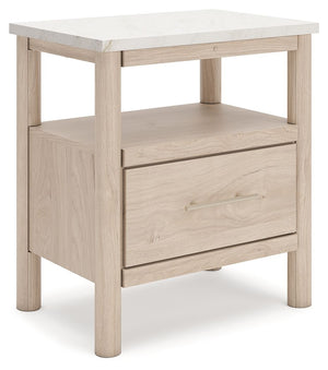 Transform your bedroom with this nightstand. With its clean lines and replicated marble top, it exudes a minimal and sophisticated boho style. Built-in lighting and charging capabilities add simplicity and ease to your everyday tasks. Tailor your space an