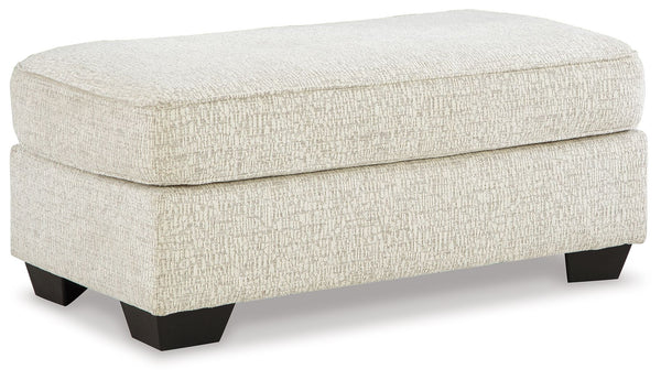 This ottoman has the corner on casual contemporary style and everyday comfort. Chic and subtly innovative, its crosshatched chenille upholstery is a forward-thinking take on fashionable neutrals. This simple, streamlined design is sure to appeal to your r
