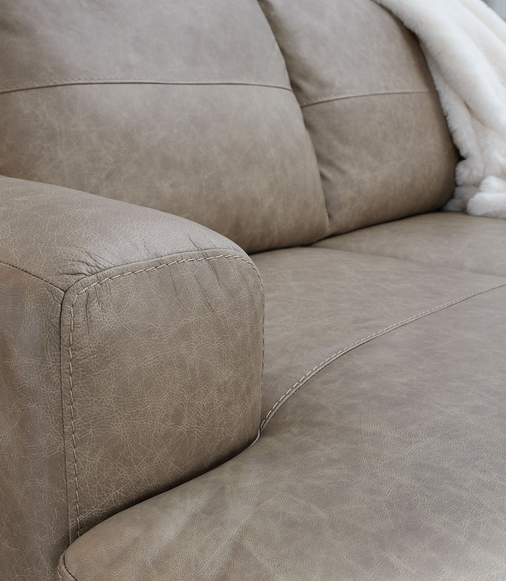 Bring a touch of indulgence and affordability into your home. This sectional with chaise prioritizes comfort to fit your modern lifestyle, with richly neutral leather and faux leather upholstery embracing you in irresistibly soft seating. It-'s a chic, co