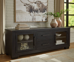  with the worn black finish giving your living room a gently aged charm. Console and media storage is made easy with cabinets and drawers. And the 