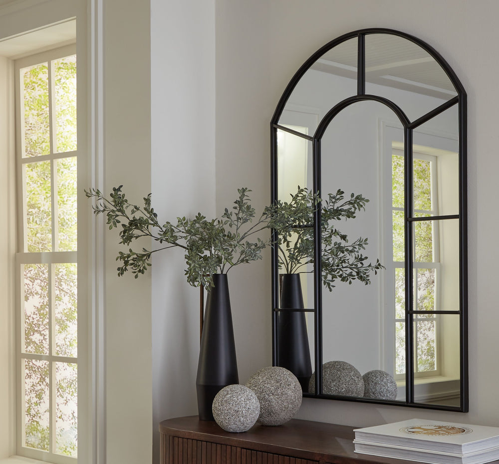 This mirror takes a classic wall accent and upgrades it with simple details. An arched design and paneled perimeter are framed with metal in a versatile black finish. Whether your room is casual or contemporary, this mirror effortlessly reflects the mood 